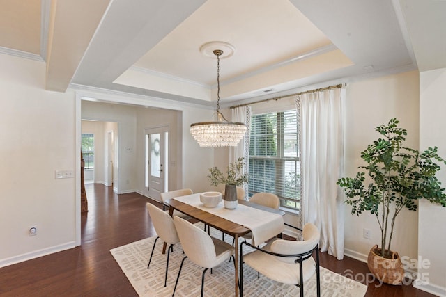 4028 Woodsmill Rd, Fort Mill, SC 29707 - dining space with a raised ceiling, plenty of natural light, a chandelier, dark wood finished floors, and crown molding