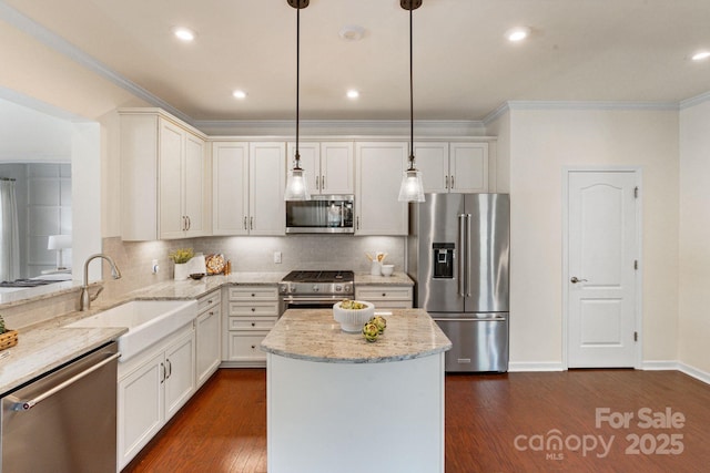 4028 Woodsmill Rd, Fort Mill, SC 29707 - kitchen with high end appliances, a sink, ornamental molding, decorative backsplash, and dark wood-style flooring