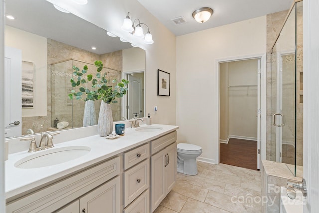 4028 Woodsmill Rd, Fort Mill, SC 29707 - bathroom with a stall shower, a spacious closet, double vanity, and toilet