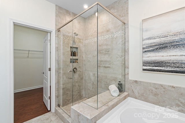 4028 Woodsmill Rd, Fort Mill, SC 29707 - bathroom featuring a stall shower, a spacious closet, and a bath