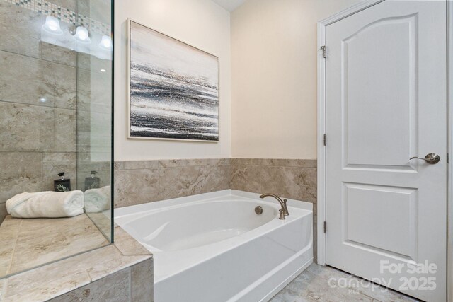 4028 Woodsmill Rd, Fort Mill, SC 29707 - full bathroom featuring a garden tub and tiled shower