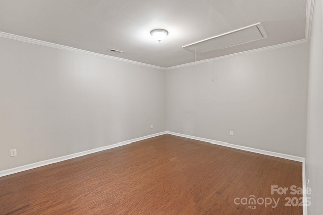 4028 Woodsmill Rd, Fort Mill, SC 29707 - empty room featuring attic access, dark wood-type flooring, baseboards, and crown molding