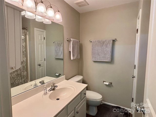 full bathroom featuring toilet and vanity