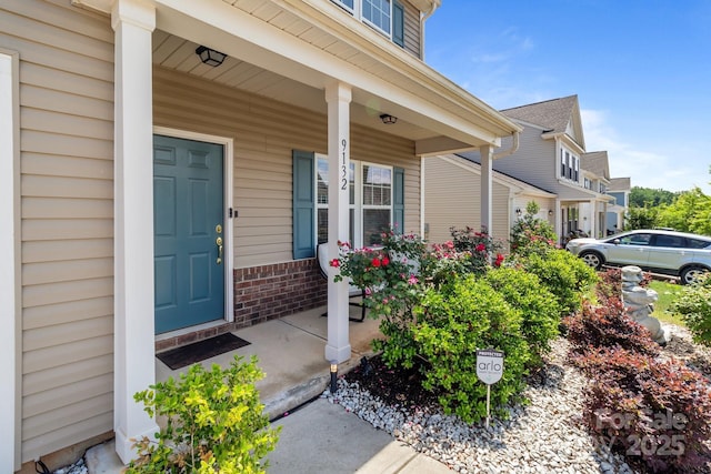 9132 Colwick Hill Ln, Charlotte, NC 28215 - view of exterior entry featuring covered porch and brick siding