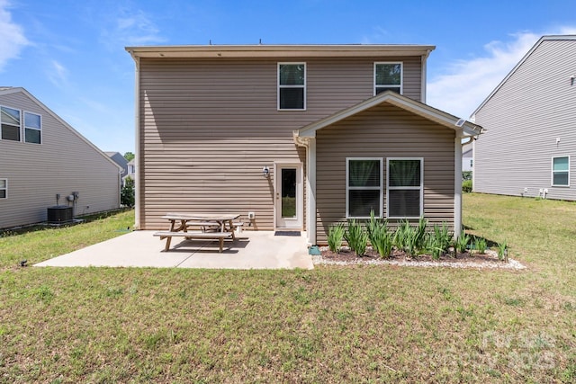 9132 Colwick Hill Ln, Charlotte, NC 28215 - back of property featuring a patio area, a lawn, and central AC