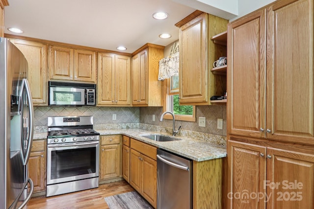 332 Mystic Cv, Waynesville, NC 28785 - kitchen with appliances with stainless steel finishes, light wood-style flooring, light stone counters, backsplash, and recessed lighting