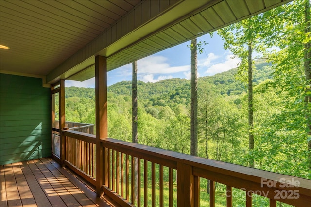 332 Mystic Cv, Waynesville, NC 28785 - wooden deck with a wooded view
