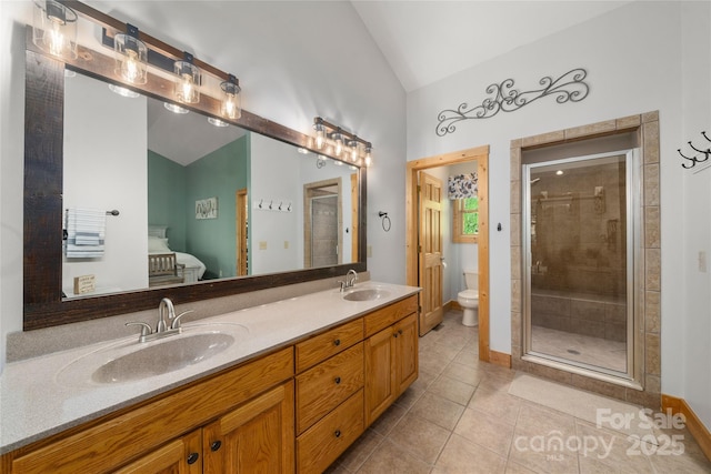 332 Mystic Cv, Waynesville, NC 28785 - full bathroom with vaulted ceiling, tile patterned floors, double vanity, and a shower stall