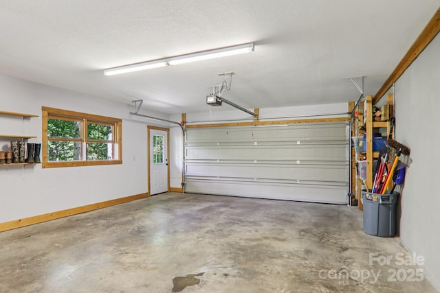 332 Mystic Cv, Waynesville, NC 28785 - garage featuring a garage door opener and baseboards