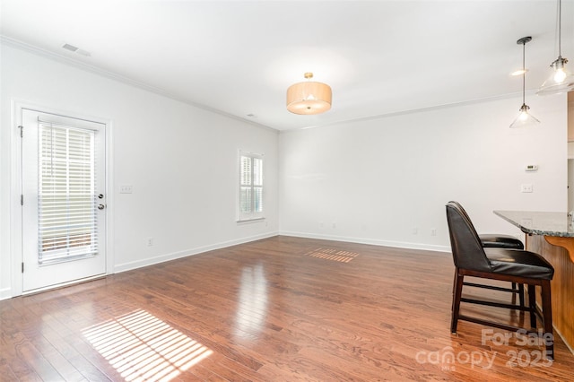 6033 Bountiful St Unit 201, Belmont, NC 28012 - unfurnished dining area with crown molding, wood finished floors, and baseboards