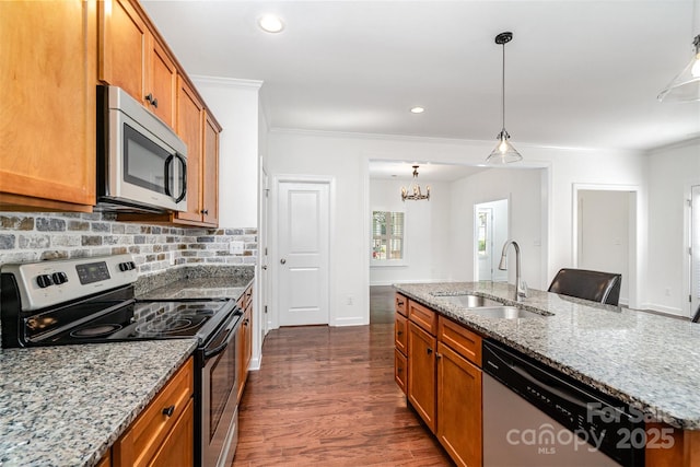 6033 Bountiful St Unit 201, Belmont, NC 28012 - kitchen with appliances with stainless steel finishes, a sink, ornamental molding, brown cabinets, and dark wood-style flooring