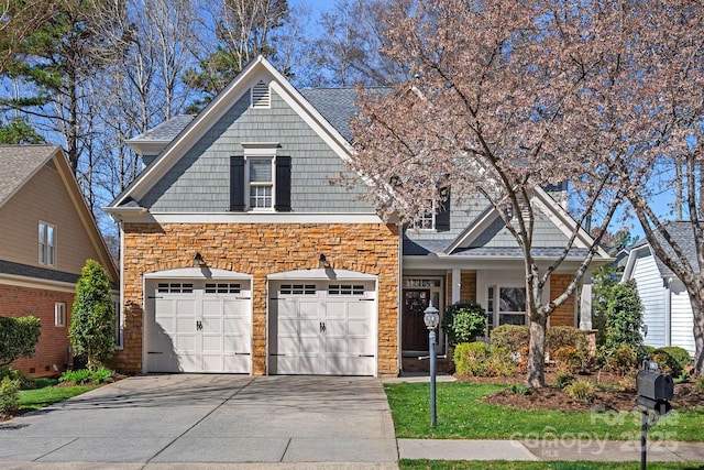 19679 Wooden Tee Dr, Davidson, NC 28036 - view of front of property featuring concrete driveway and stone siding