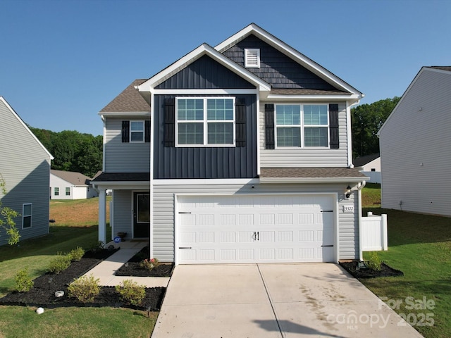 3322 Brighton Dr, Gastonia, NC 28052 - view of front of property featuring a garage, board and batten siding, driveway, and a front lawn