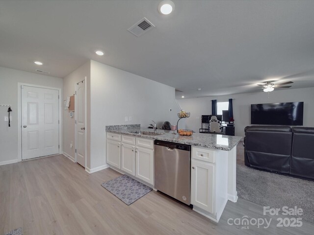 3322 Brighton Dr, Gastonia, NC 28052 - kitchen featuring dishwasher, open floor plan, a peninsula, light wood finished floors, and white cabinetry