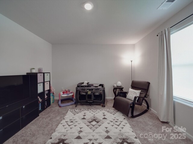 3322 Brighton Dr, Gastonia, NC 28052 - sitting room featuring light carpet, healthy amount of natural light, and baseboards