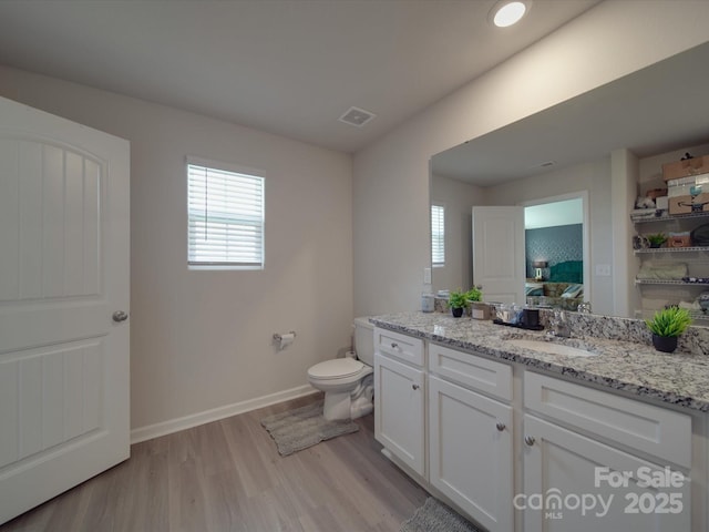 3322 Brighton Dr, Gastonia, NC 28052 - bathroom with ensuite bathroom, wood finished floors, vanity, toilet, and baseboards