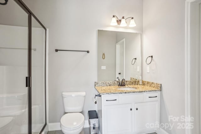 21610 Rio Oro Dr, Cornelius, NC 28031 - bathroom with toilet, a shower stall, vanity, and baseboards