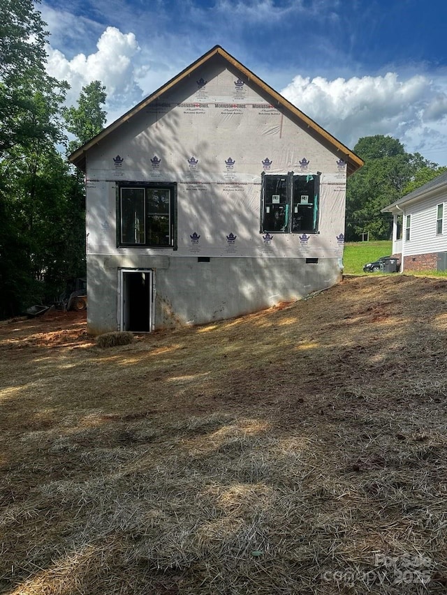 view of side of home with crawl space