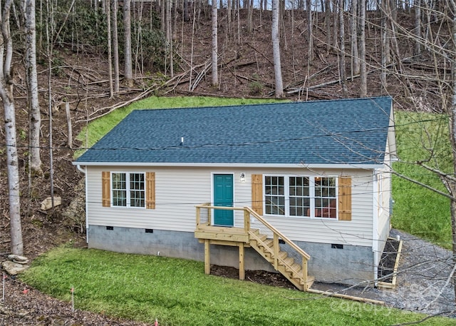 62 Leisure Ln, Maggie Valley, NC 28751 - view of front of house with crawl space, a shingled roof, and a front lawn