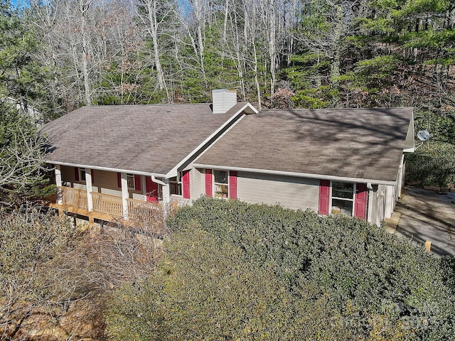 703 Cinnamon Way, Flat Rock, NC 28731 - view of front of home with a chimney, a shingled roof, and a porch