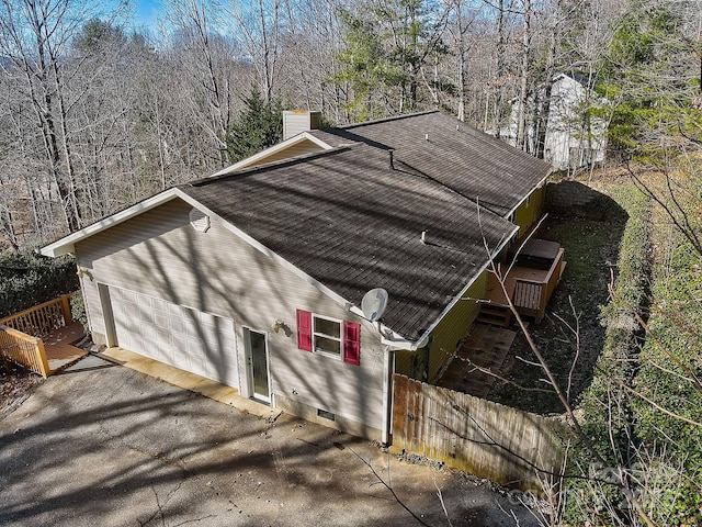 703 Cinnamon Way, Flat Rock, NC 28731 - view of property exterior featuring a chimney, roof with shingles, fence, and crawl space