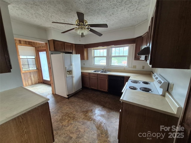 kitchen with white appliances, a sink, under cabinet range hood, a ceiling fan, and a textured ceiling