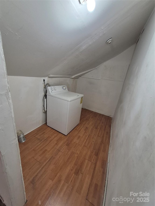 washroom with washer / dryer and light wood-style floors