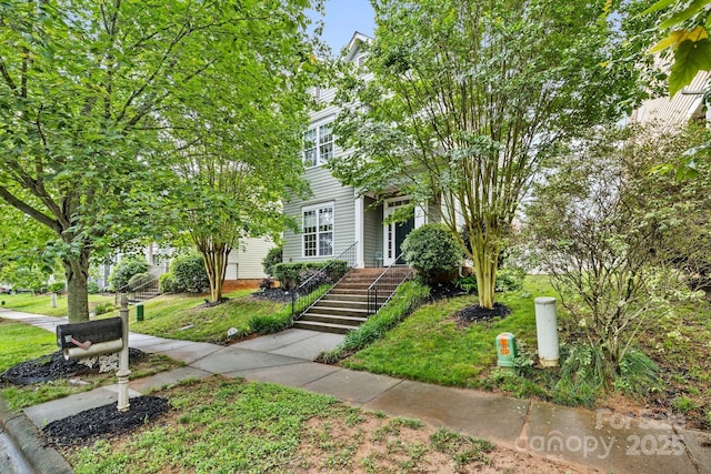 132 E Morehouse Ave, Mooresville, NC 28117 - view of property hidden behind natural elements featuring a front lawn