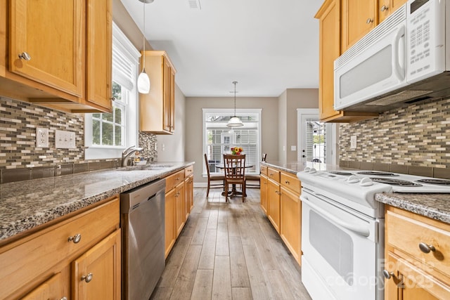 132 E Morehouse Ave, Mooresville, NC 28117 - kitchen with white appliances, light wood-type flooring, backsplash, and plenty of natural light
