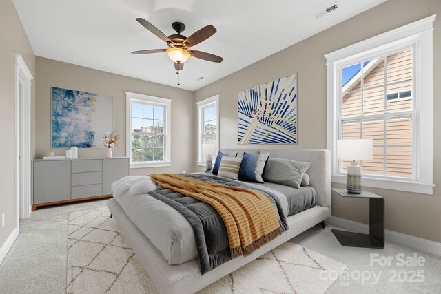 132 E Morehouse Ave, Mooresville, NC 28117 - carpeted bedroom featuring baseboards and ceiling fan