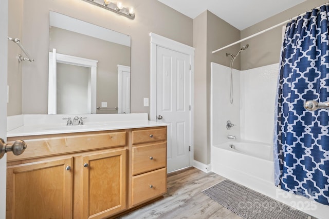 132 E Morehouse Ave, Mooresville, NC 28117 - full bathroom with wood finished floors, vanity, shower / bath combination with curtain, and baseboards