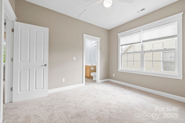132 E Morehouse Ave, Mooresville, NC 28117 - unfurnished bedroom featuring attic access, carpet flooring, baseboards, connected bathroom, and ceiling fan