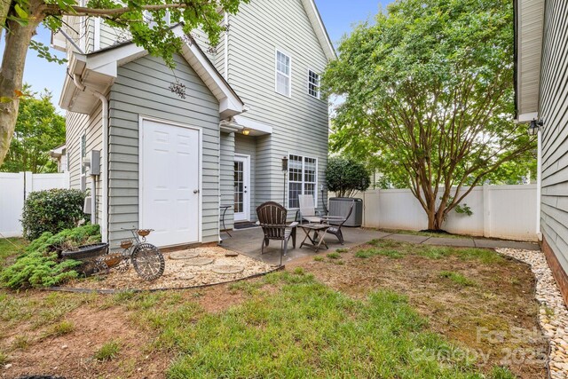 132 E Morehouse Ave, Mooresville, NC 28117 - back of house with a patio, a fenced backyard, and central AC