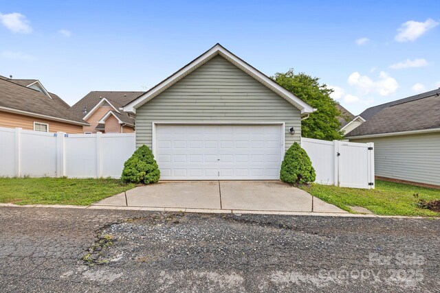 132 E Morehouse Ave, Mooresville, NC 28117 - garage featuring fence and a gate
