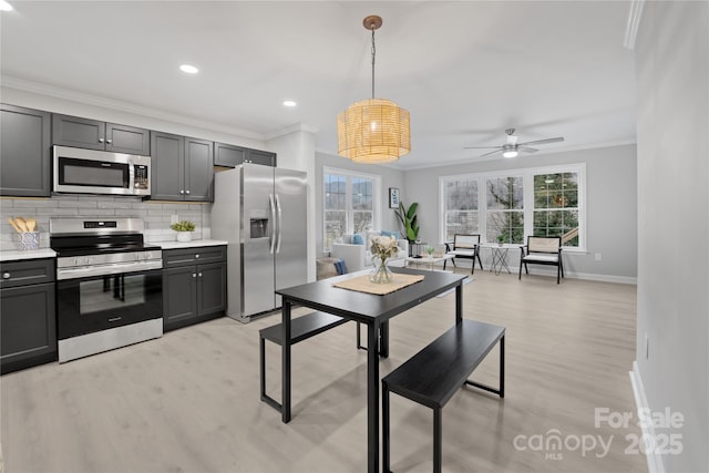 60 Leisure Ln, Maggie Valley, NC 28751 - kitchen with appliances with stainless steel finishes, baseboards, crown molding, light wood-style flooring, and light countertops