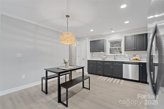 60 Leisure Ln, Maggie Valley, NC 28751 - kitchen with appliances with stainless steel finishes, tasteful backsplash, ornamental molding, light countertops, and recessed lighting