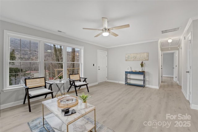 60 Leisure Ln, Maggie Valley, NC 28751 - living area with attic access, ceiling fan, ornamental molding, baseboards, and light wood-style floors