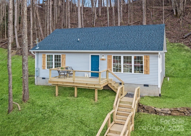 60 Leisure Ln, Maggie Valley, NC 28751 - view of front facade featuring crawl space, a wooden deck, a shingled roof, and a front yard