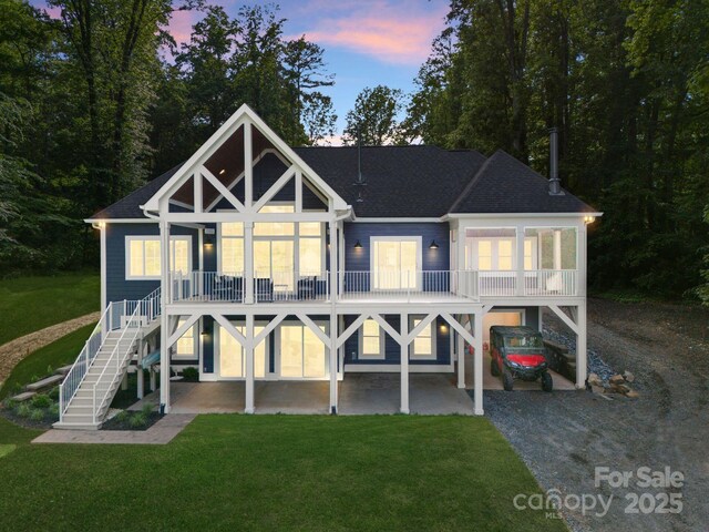 434 Breezewood Dr, Belmont, NC 28012 - rear view of house with a carport, a lawn, driveway, and stairs