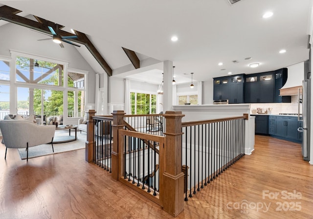 434 Breezewood Dr, Belmont, NC 28012 - kitchen with a ceiling fan, open floor plan, light wood finished floors, light countertops, and tasteful backsplash