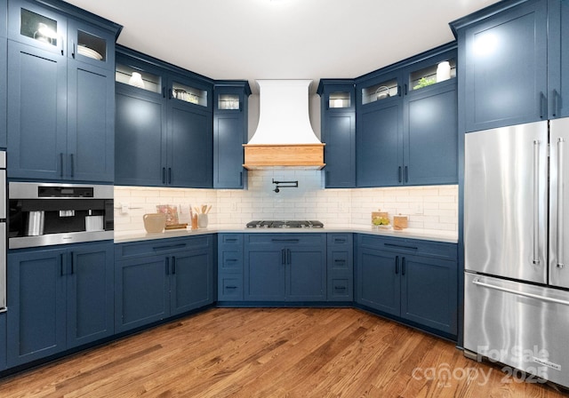 434 Breezewood Dr, Belmont, NC 28012 - kitchen featuring stainless steel appliances, custom exhaust hood, and blue cabinets