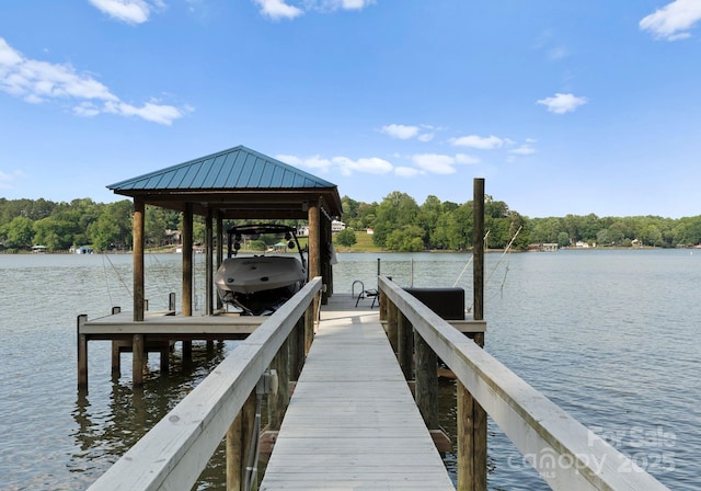 434 Breezewood Dr, Belmont, NC 28012 - dock with boat lift, a water view, and a wooded view