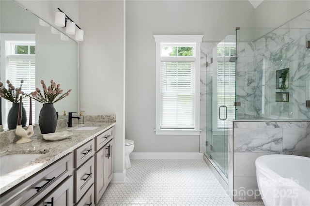 434 Breezewood Dr, Belmont, NC 28012 - bathroom with double vanity, a freestanding tub, plenty of natural light, and a marble finish shower