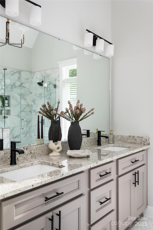 434 Breezewood Dr, Belmont, NC 28012 - bathroom with double vanity, a marble finish shower, a chandelier, and vaulted ceiling