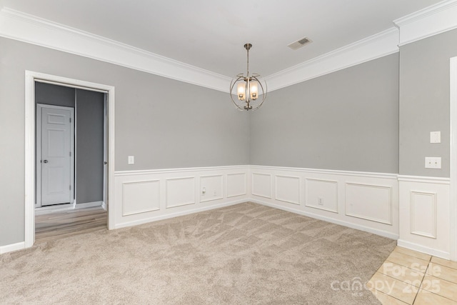 14857 Santa Lucia Dr, Charlotte, NC 28277 - carpeted spare room featuring ornamental molding and a chandelier