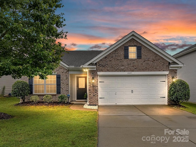 2005 Grimley Ln, Fort Mill, SC 29707 - view of front of home with brick siding, a lawn, and driveway