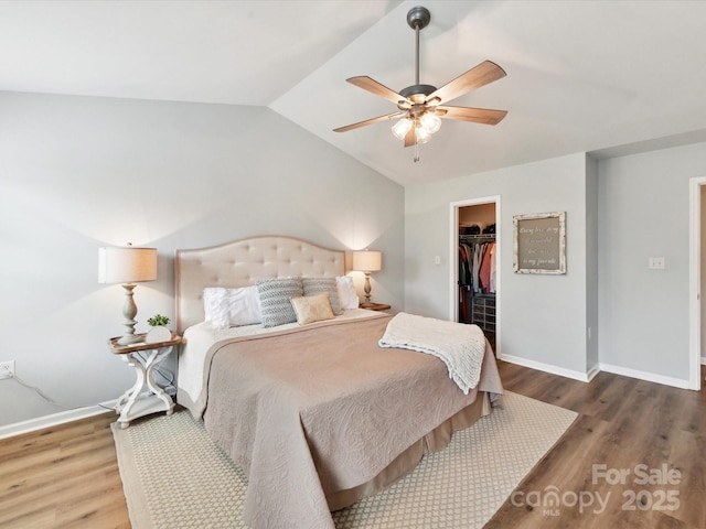 2005 Grimley Ln, Fort Mill, SC 29707 - bedroom with lofted ceiling, a spacious closet, wood finished floors, baseboards, and a closet