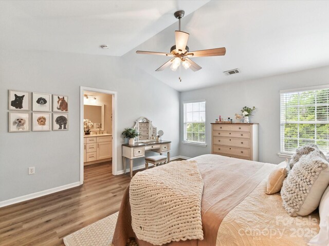2005 Grimley Ln, Fort Mill, SC 29707 - bedroom featuring wood finished floors, lofted ceiling, baseboards, ceiling fan, and ensuite bath