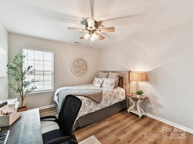 2005 Grimley Ln, Fort Mill, SC 29707 - bedroom featuring baseboards, wood finished floors, ceiling fan, and an office area