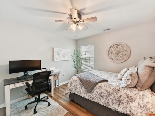 2005 Grimley Ln, Fort Mill, SC 29707 - bedroom with an office area, wood finished floors, baseboards, and a ceiling fan